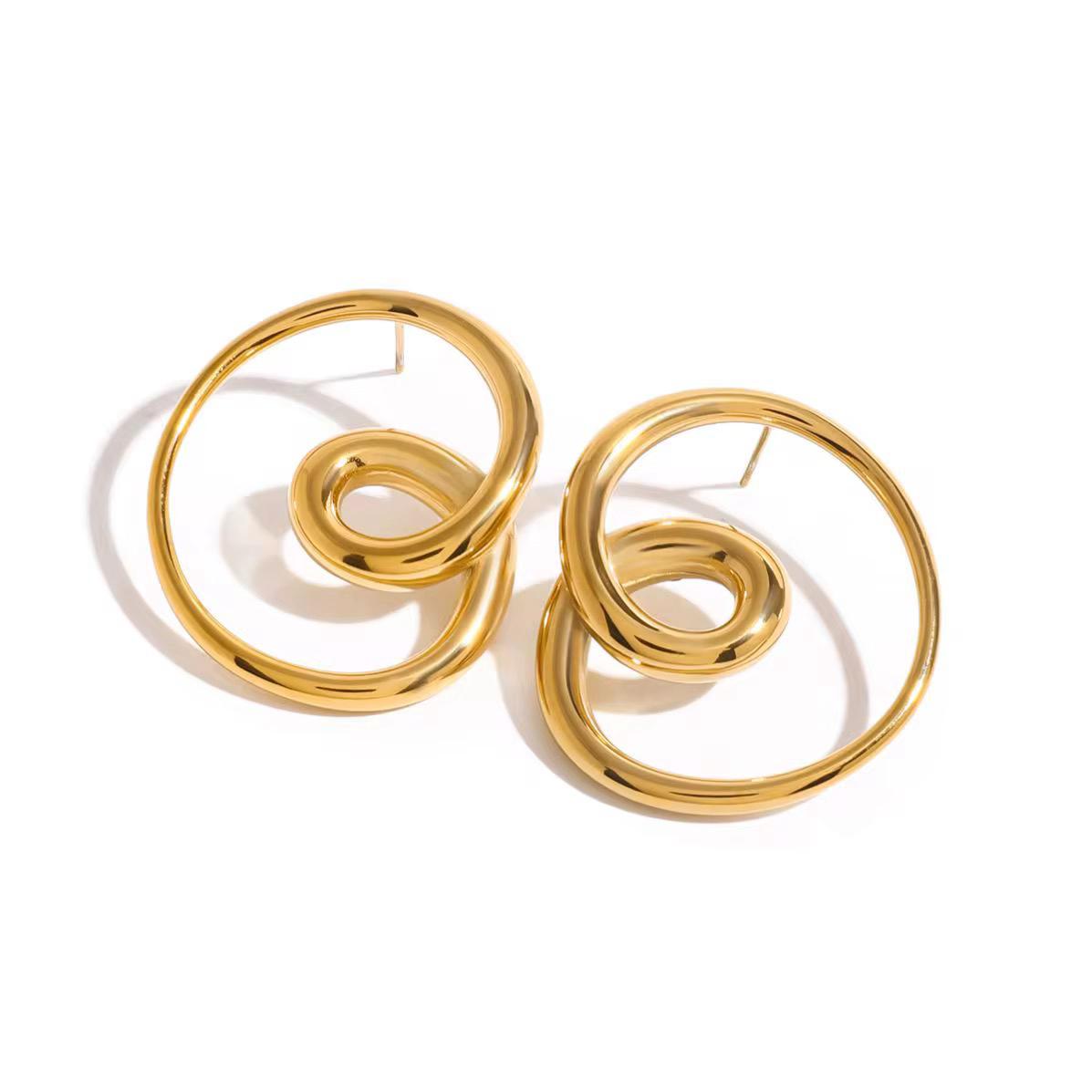 Heart-shaped gold thread earrings on white background – Love Threads design.